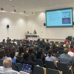 A presentation being given by Dr Raphaella Hull of Cambridge University Botanic Garden to a conference room of PhD students